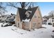 Tan two-story house with snow covered yard at 714 Berkley Rd, Indianapolis, IN 46208