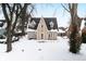 Tan two-story house with snow covered yard at 714 Berkley Rd, Indianapolis, IN 46208