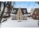 Tan two-story house with snow covered yard at 714 Berkley Rd, Indianapolis, IN 46208