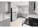 Modern kitchen featuring stainless steel appliances and tile flooring at 714 Berkley Rd, Indianapolis, IN 46208