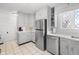 Updated kitchen, stainless steel appliances, white quartz counters at 714 Berkley Rd, Indianapolis, IN 46208