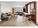 Large living room, hardwood floors, wood paneled accent wall at 714 Berkley Rd, Indianapolis, IN 46208