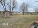 Large backyard with sheds and pond view at 819 Cypress S, Greenwood, IN 46143