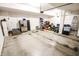 Spacious garage with overhead storage and ample room for vehicles and tools at 8503 Ironhill Ct, Indianapolis, IN 46259