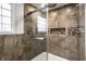 Modern glass shower enclosure with tile walls, dual shower heads, and a built-in niche for toiletries storage at 9036 Tilly Mill Rd, Indianapolis, IN 46278