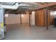 Unfinished basement with high ceilings and concrete floor at 906 Raible Ave, Anderson, IN 46011