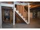 Unfinished basement with exposed beams and concrete floor at 906 Raible Ave, Anderson, IN 46011