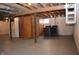 Unfinished basement with laundry hookups and storage at 906 Raible Ave, Anderson, IN 46011