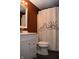 Clean bathroom with white vanity and mountain-themed shower curtain at 906 Raible Ave, Anderson, IN 46011