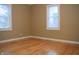 Spacious bedroom with hardwood floors and neutral walls at 906 Raible Ave, Anderson, IN 46011