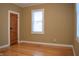 Hardwood floors and neutral walls in this bright bedroom at 906 Raible Ave, Anderson, IN 46011