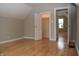 Bedroom with hardwood floors, gray walls and two connecting rooms at 906 Raible Ave, Anderson, IN 46011