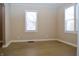 Dining room with hardwood floors and two windows at 906 Raible Ave, Anderson, IN 46011