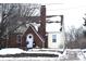 Brick and siding house with snow covered roof and yard at 906 Raible Ave, Anderson, IN 46011