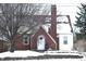 Brick and siding house with snow covered roof and yard at 906 Raible Ave, Anderson, IN 46011