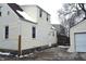 Side view of house with additional garage and fence at 906 Raible Ave, Anderson, IN 46011