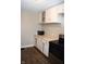 White kitchen cabinets, new flooring and modern stove at 906 Raible Ave, Anderson, IN 46011