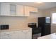 Bright eat-in kitchen, featuring updated appliances and cabinetry at 906 Raible Ave, Anderson, IN 46011