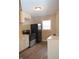 Galley kitchen with black appliances and white cabinets at 906 Raible Ave, Anderson, IN 46011