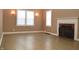 Living room with hardwood floors and fireplace at 906 Raible Ave, Anderson, IN 46011