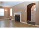 Living room with hardwood floors and fireplace at 906 Raible Ave, Anderson, IN 46011