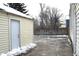 Side yard view of house with fence and additional garage at 906 Raible Ave, Anderson, IN 46011