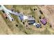 Aerial view of the property showcasing the house, garage, pool, and long driveway with a semi-truck at 10194 E 900 N, Markleville, IN 46056