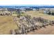 Extensive aerial view of rural land with interspersed fields, clusters of trees, and buildings at 10194 E 900 N, Markleville, IN 46056