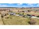Aerial view showcasing the property's home, large yard, inground pool, detached garage and semi truck at 10194 E 900 N, Markleville, IN 46056