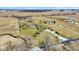 Panoramic aerial shot of property with open fields, and a long driveway leading to the house at 10194 E 900 N, Markleville, IN 46056