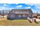 Charming brick home with a covered porch, outdoor seating, and a spacious backyard at 10194 E 900 N, Markleville, IN 46056