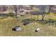 Spacious backyard features a swing set, picnic table, fire pit and benches for outdoor enjoyment at 10194 E 900 N, Markleville, IN 46056