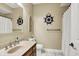Clean bathroom with a ship's wheel decoration and shower at 10194 E 900 N, Markleville, IN 46056