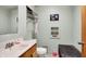 Simple bathroom with a sink, toilet and storage at 10194 E 900 N, Markleville, IN 46056