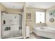 Relaxing bathroom with a walk-in shower and corner bathtub at 10194 E 900 N, Markleville, IN 46056