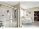 Modern bathroom with a walk-in shower, bathtub, and ample closet space at 10194 E 900 N, Markleville, IN 46056