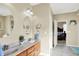 Spa-like bathroom featuring double sinks, and a view into bedroom at 10194 E 900 N, Markleville, IN 46056