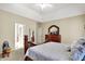 Comfortable bedroom with ensuite bathroom access and a ceiling fan at 10194 E 900 N, Markleville, IN 46056