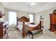 Spacious bedroom with a large bed, dresser, and plenty of natural light at 10194 E 900 N, Markleville, IN 46056