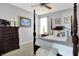 Spacious bedroom with a post bed, dresser, and window at 10194 E 900 N, Markleville, IN 46056
