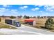 Picture of the property, featuring a semi truck parked near the home with a detached garage on the property at 10194 E 900 N, Markleville, IN 46056