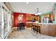 Kitchen features wood cabinets, stainless steel appliances, and breakfast nook at 10194 E 900 N, Markleville, IN 46056