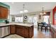 Island kitchen with double sink, granite countertops, and access to backyard at 10194 E 900 N, Markleville, IN 46056