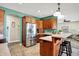 Kitchen with stainless steel appliances and green accent wall at 10194 E 900 N, Markleville, IN 46056