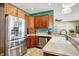 Stainless steel appliances and wood cabinets in the kitchen at 10194 E 900 N, Markleville, IN 46056