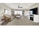 Living room with fireplace, large TV and comfy seating at 10194 E 900 N, Markleville, IN 46056