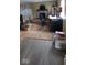 Home office with stone fireplace and wood-look floors at 10194 E 900 N, Markleville, IN 46056