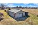 Outbuilding features one large bay and a smaller covered area perfect for working on equipment or hobbies at 10194 E 900 N, Markleville, IN 46056