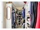 Spacious walk-in closet with shelves and hanging rods for storage at 10194 E 900 N, Markleville, IN 46056