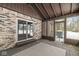 Sunroom with sliding glass doors, brick walls, and screened windows at 10483 Lakeshore Pl, Carmel, IN 46033